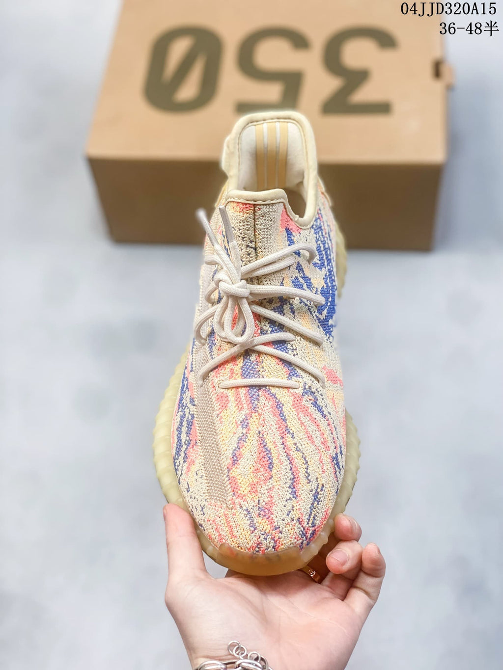 Front view of the multicolor lace-up sneaker; image overlay shows sizes 36–48.5 and style code 04JJD320A15.