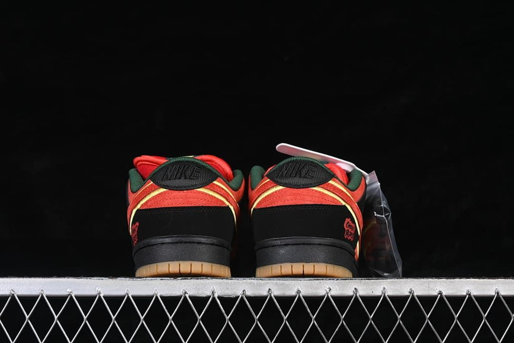 Rear view of the pair showing heel panels, green lining, and gum-colored outsole edges.