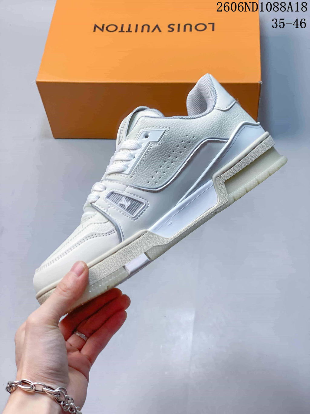 Side profile of a white Louis Vuitton Trainer low-top sneaker