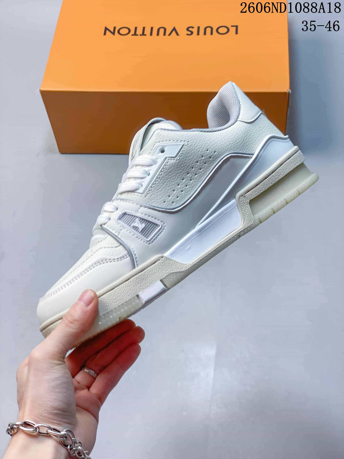 Side profile of a white Louis Vuitton Trainer low-top sneaker