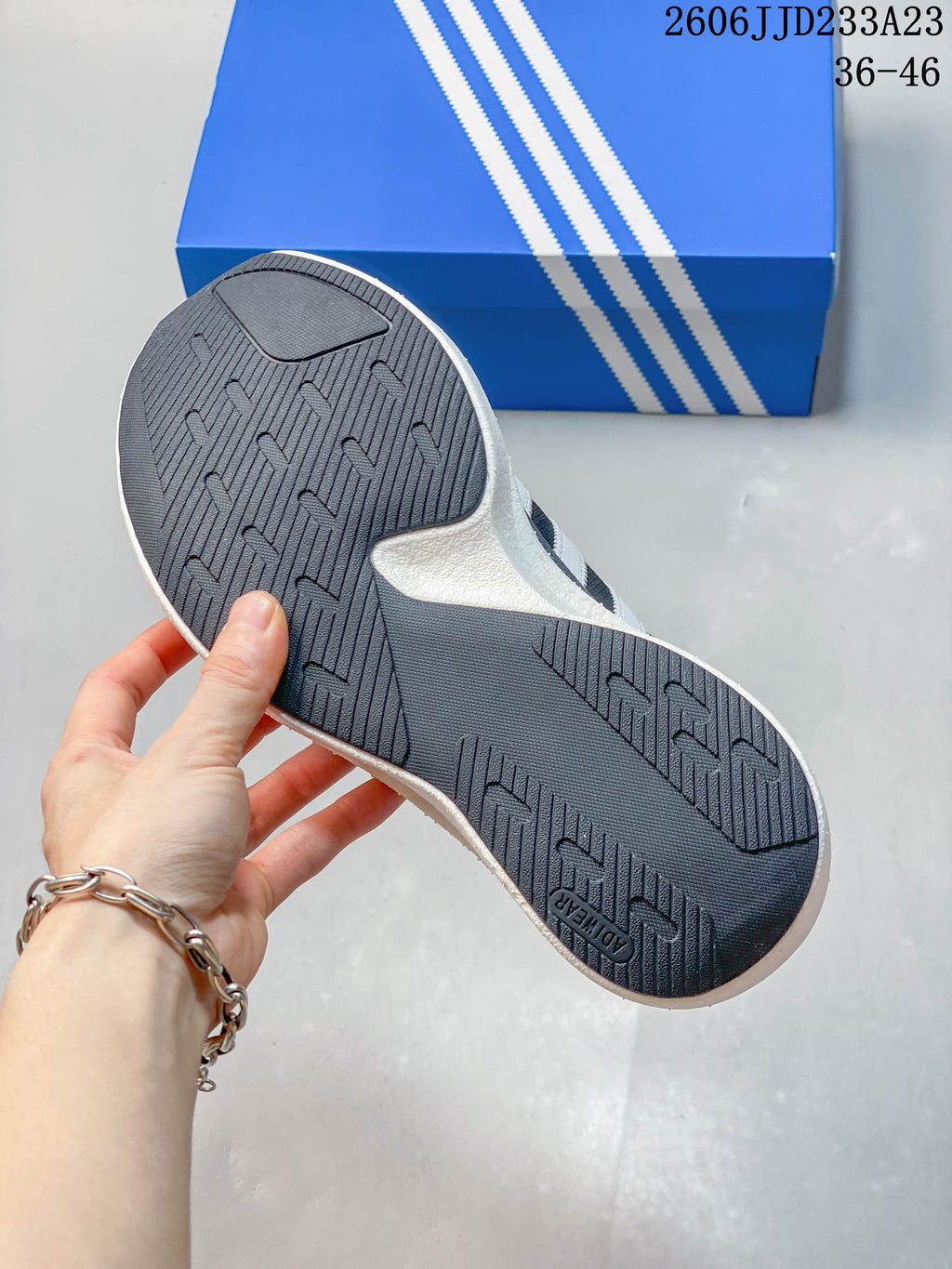 Close-up of the dark patterned outsole on an adidas Originals SL 72 Pro sneaker