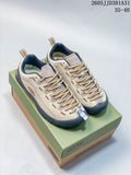 Beige and navy KEEN Jasper sneakers displayed on a shoebox