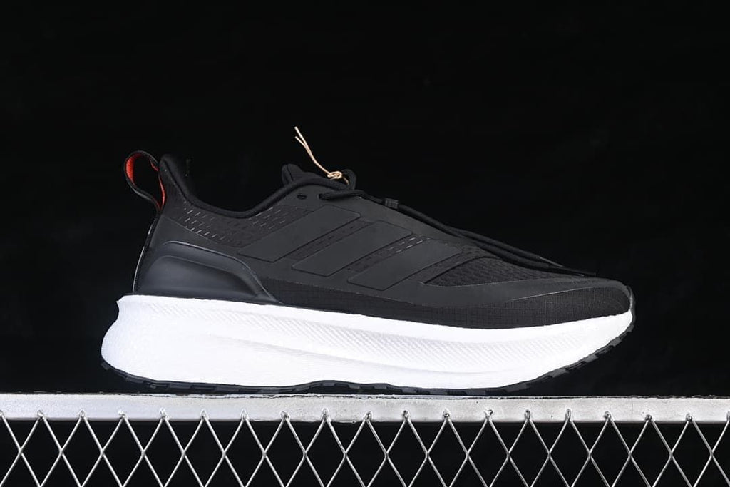 Side profile of a black adidas Ultraboost 5 shoe with a white midsole.
