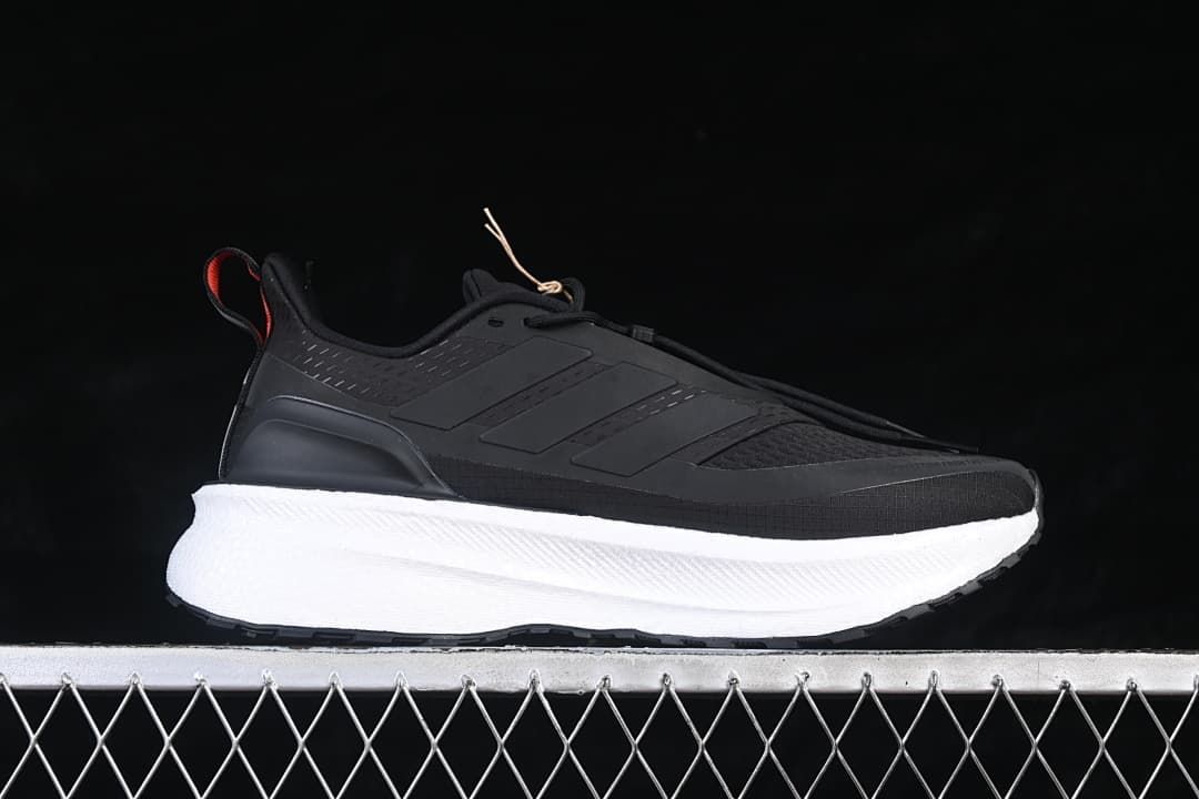 Side profile of a black adidas Ultraboost 5 shoe with a white midsole.