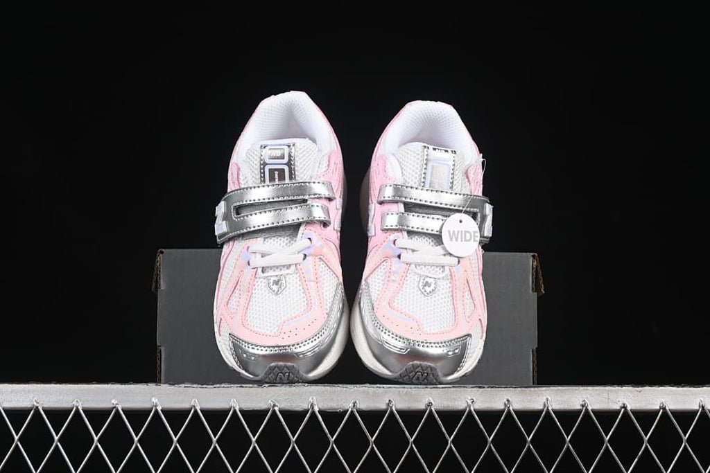 Front view of the pair showing the laces, hook-and-loop straps, and contrasting toe details.