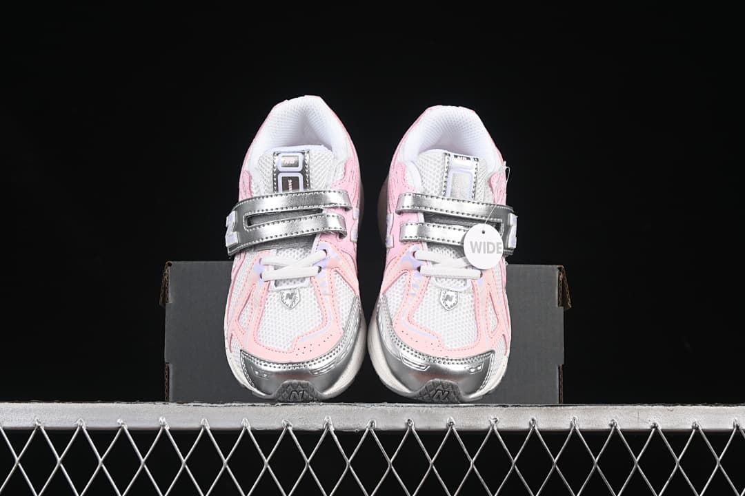Front view of the pair showing the laces, hook-and-loop straps, and contrasting toe details.