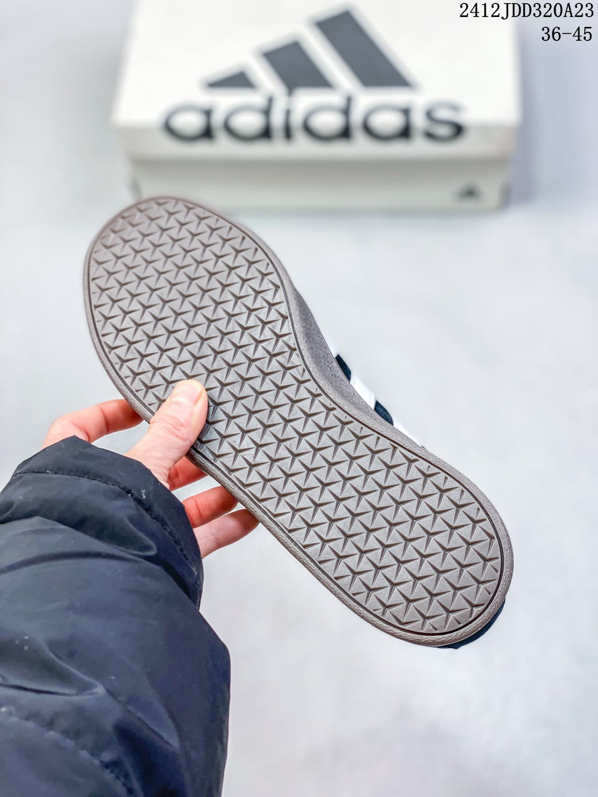 Close-up of the gray patterned outsole on an Adidas VL Court Classic sneaker
