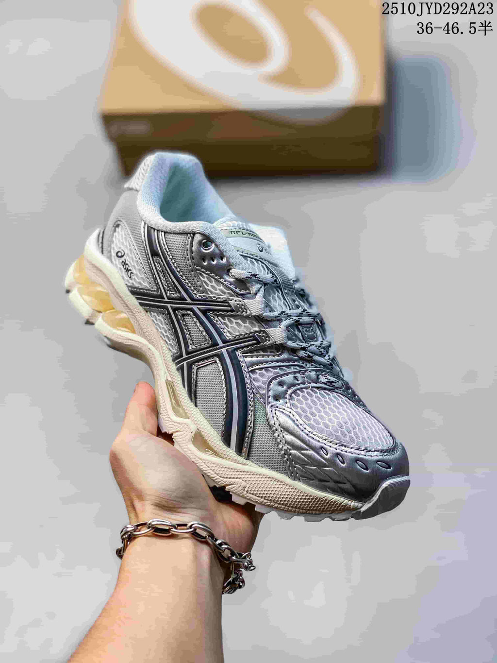 Silver and black ASICS Gel-Nimbus sneaker with a pale sculpted-looking sole.