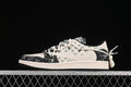 Side view of a black and cream patterned low-top sneaker with green motifs and cords tied at the heel.