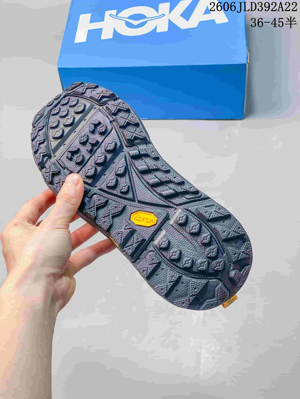 Close-up of the patterned outsole with a yellow Vibram mark