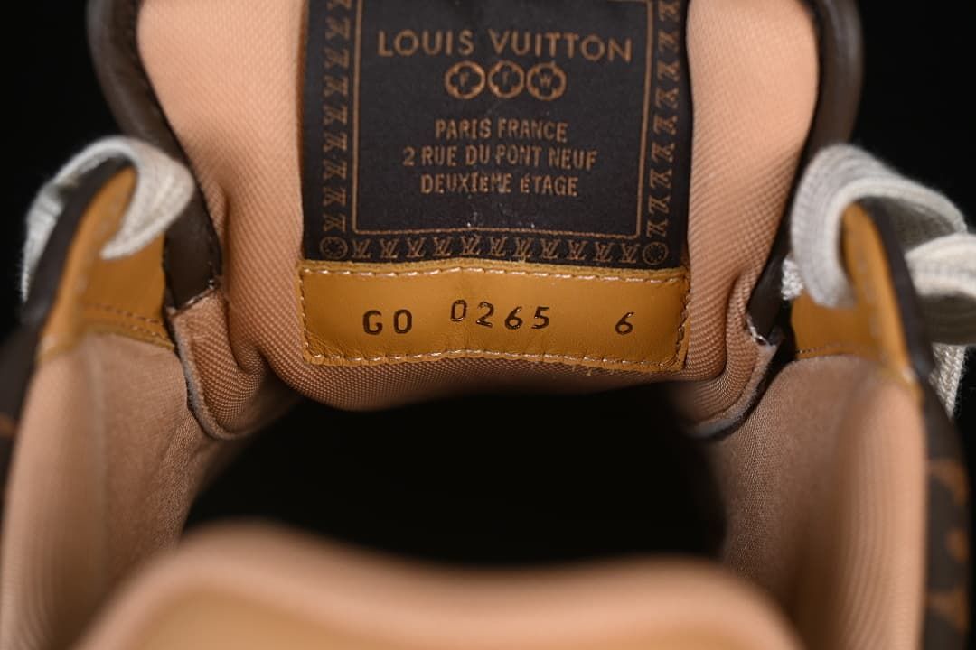 Close view of the tongue label and size marking inside the sneaker.