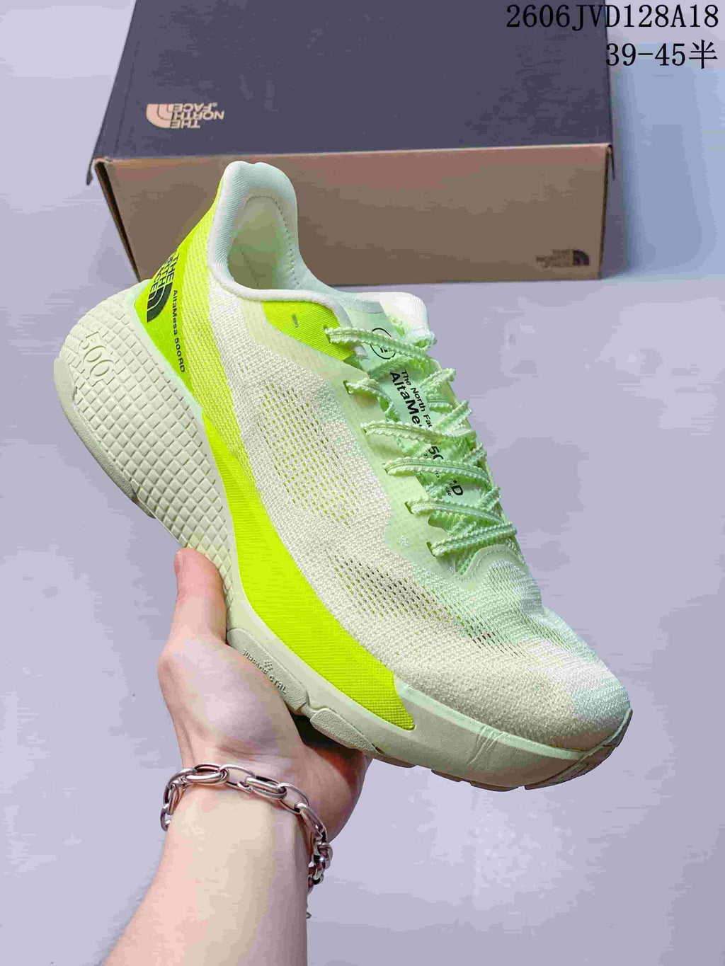 Side view of a white Alta Mesa 500 running shoe with bright lime accents.
