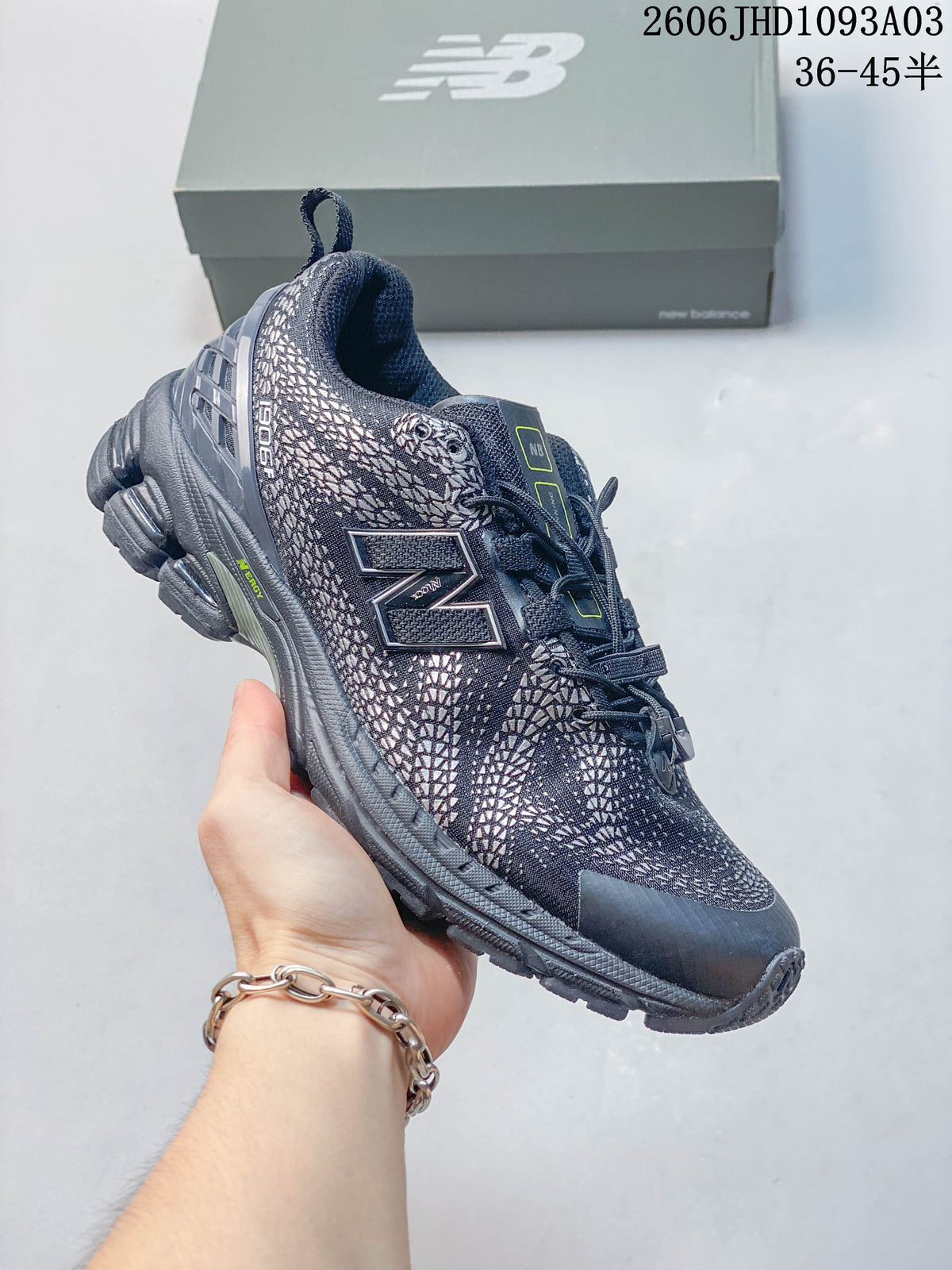 Dark navy New Balance 1906U sneaker with a patterned upper