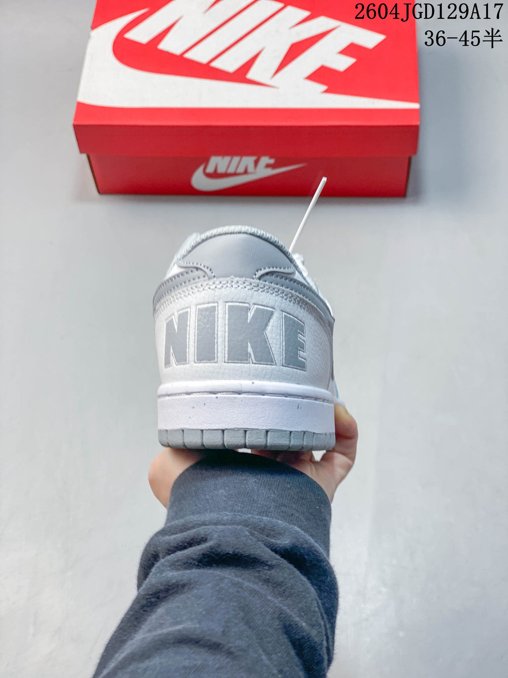 Rear view showing the Nike wordmark and grey heel details.