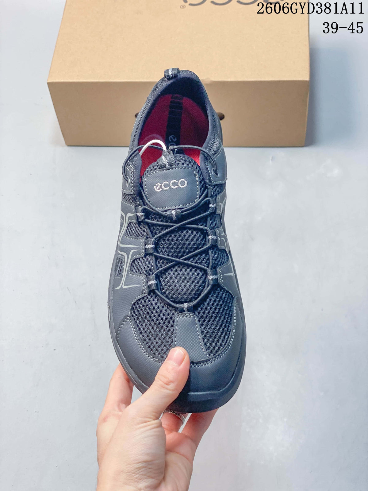 Top view of a gray sneaker showing the elasticated lace system and red interior.