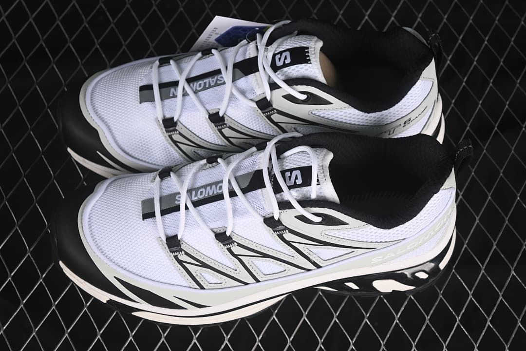 Pair of white, gray, and black Salomon XT-6 Expanse sneakers viewed from above.