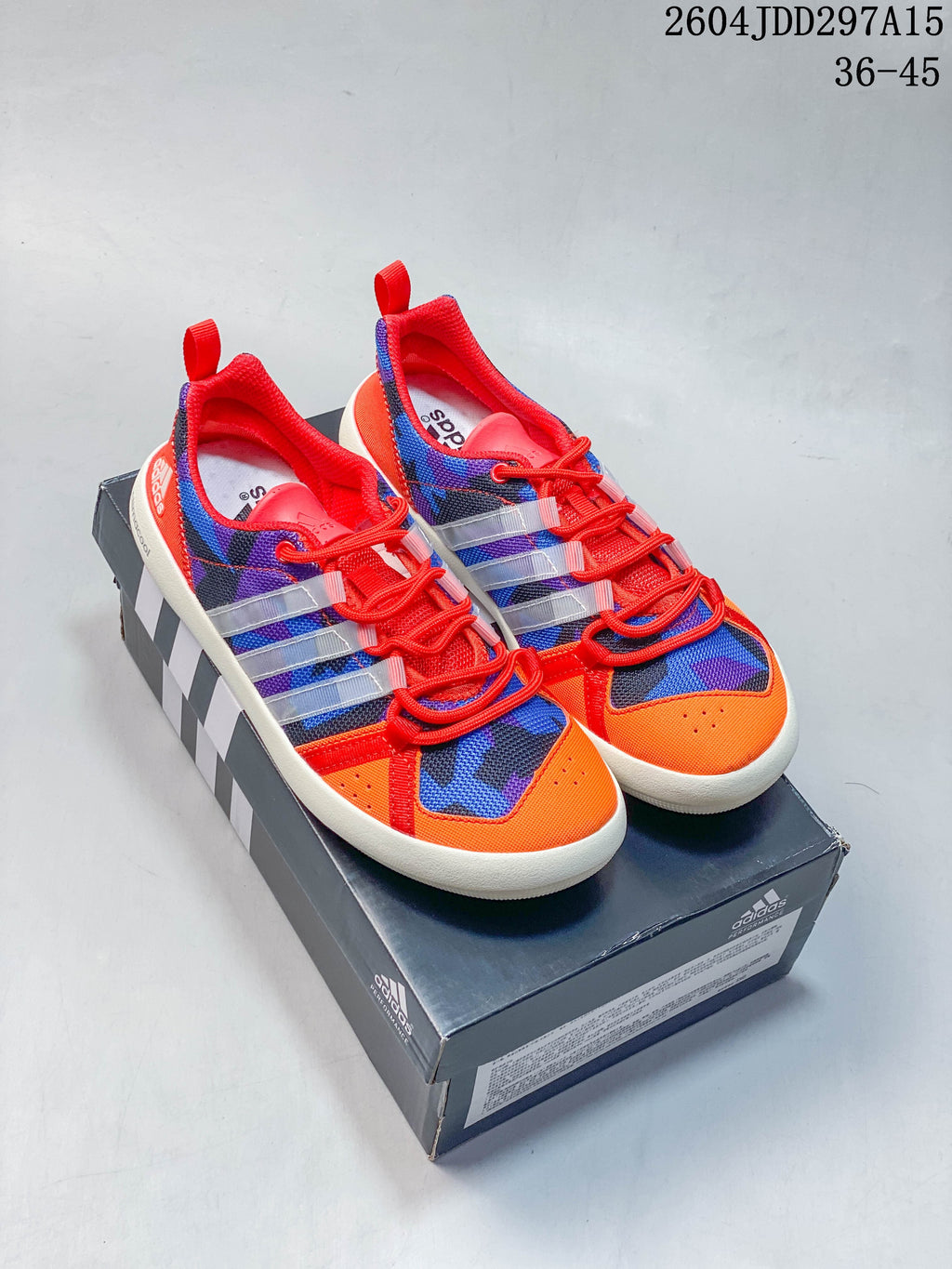 Pair of colorful adidas Terrex CC Boat shoes displayed on a box