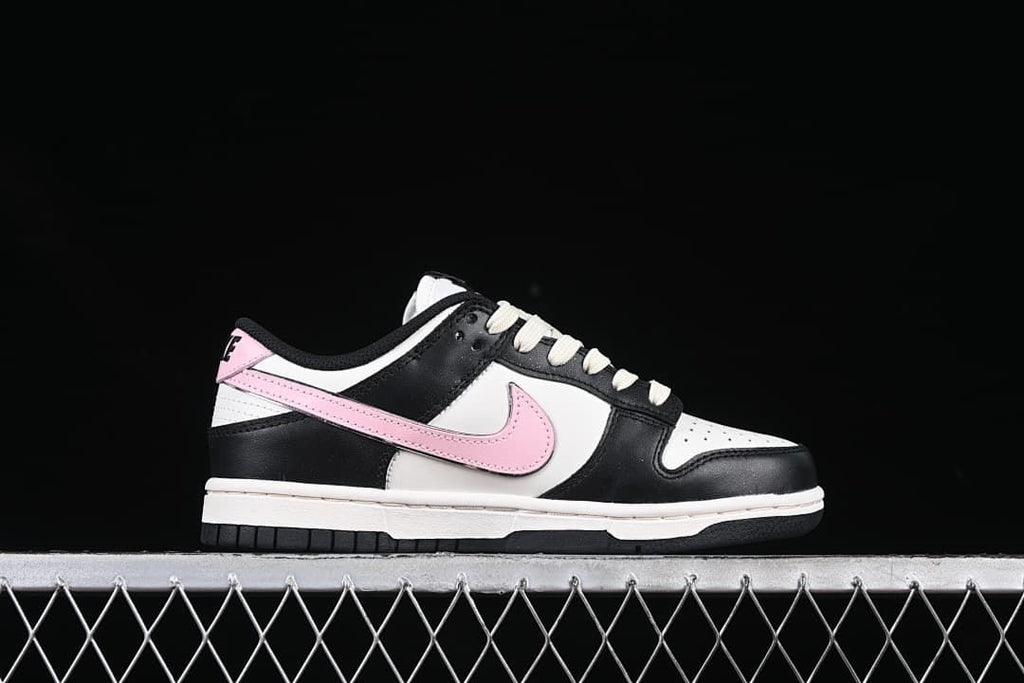 Side profile of the black, white, and pink low-top sneaker
