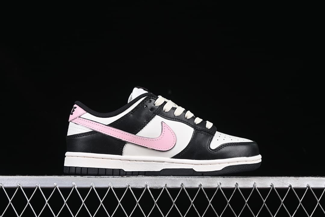 Side profile of the black, white, and pink low-top sneaker