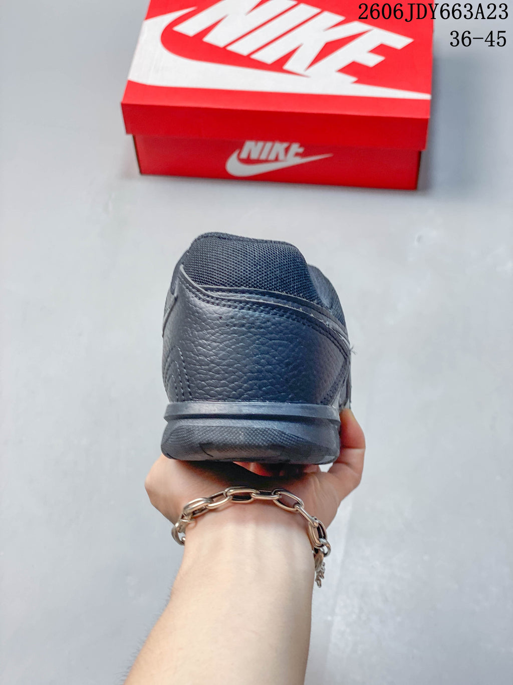 Rear view of a dark gray Nike Gato sneaker