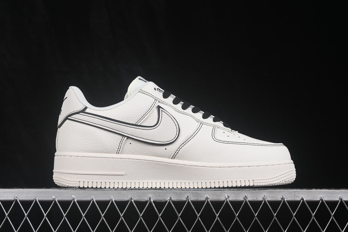 Side profile highlighting the white upper, outlined Swoosh and low-top construction.