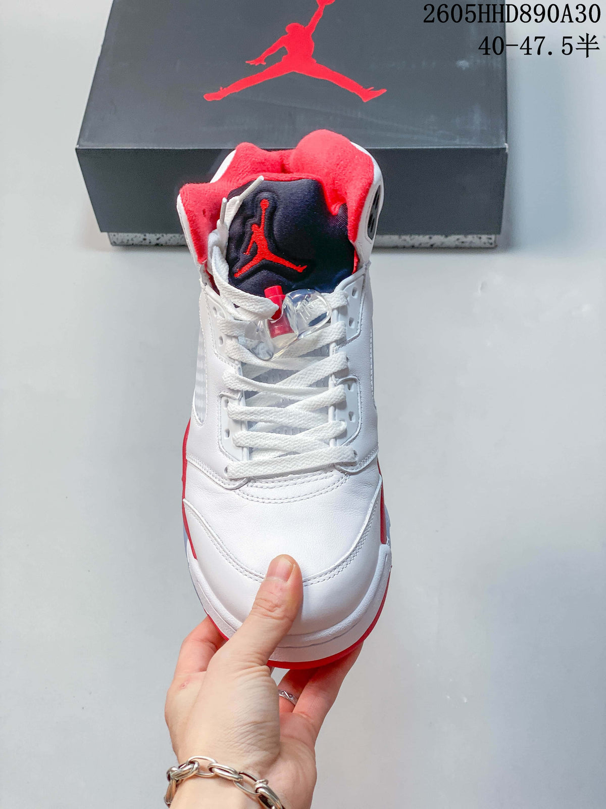 Front view showing the laces, lace locks, and contrasting tongue