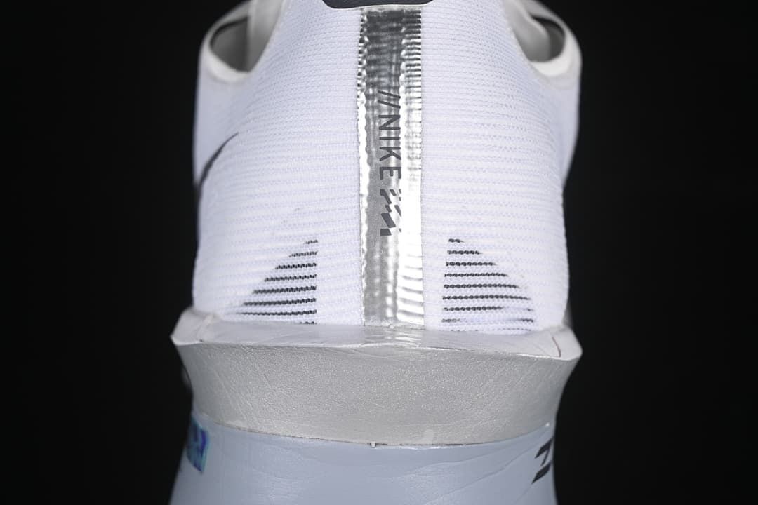 Rear view highlighting the heel tab, silver-toned strip, and sculpted midsole.
