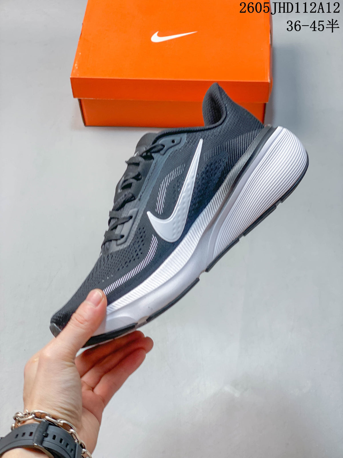 Side profile of a dark gray Nike Air Zoom Pegasus 42 with white swoosh and midsole