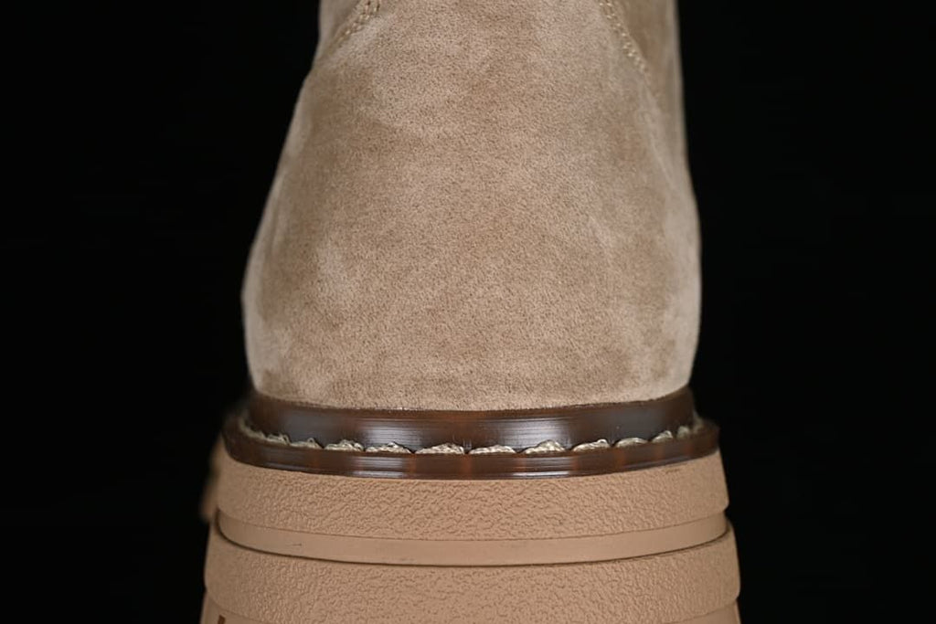 Rear close-up showing the khaki heel, brown welt detail, and layered sole.