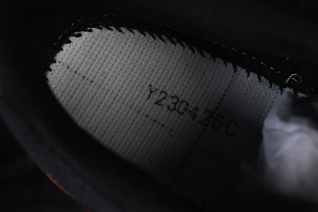 Close-up of the shoe interior showing the printed size 230-26C