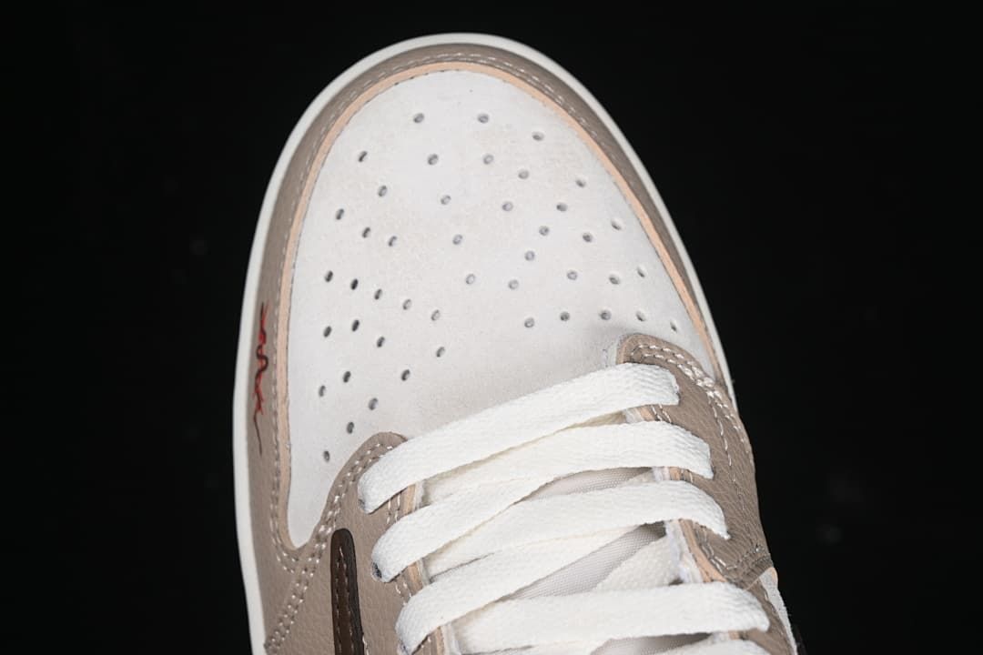 Top view of the perforated toe box and white laces.