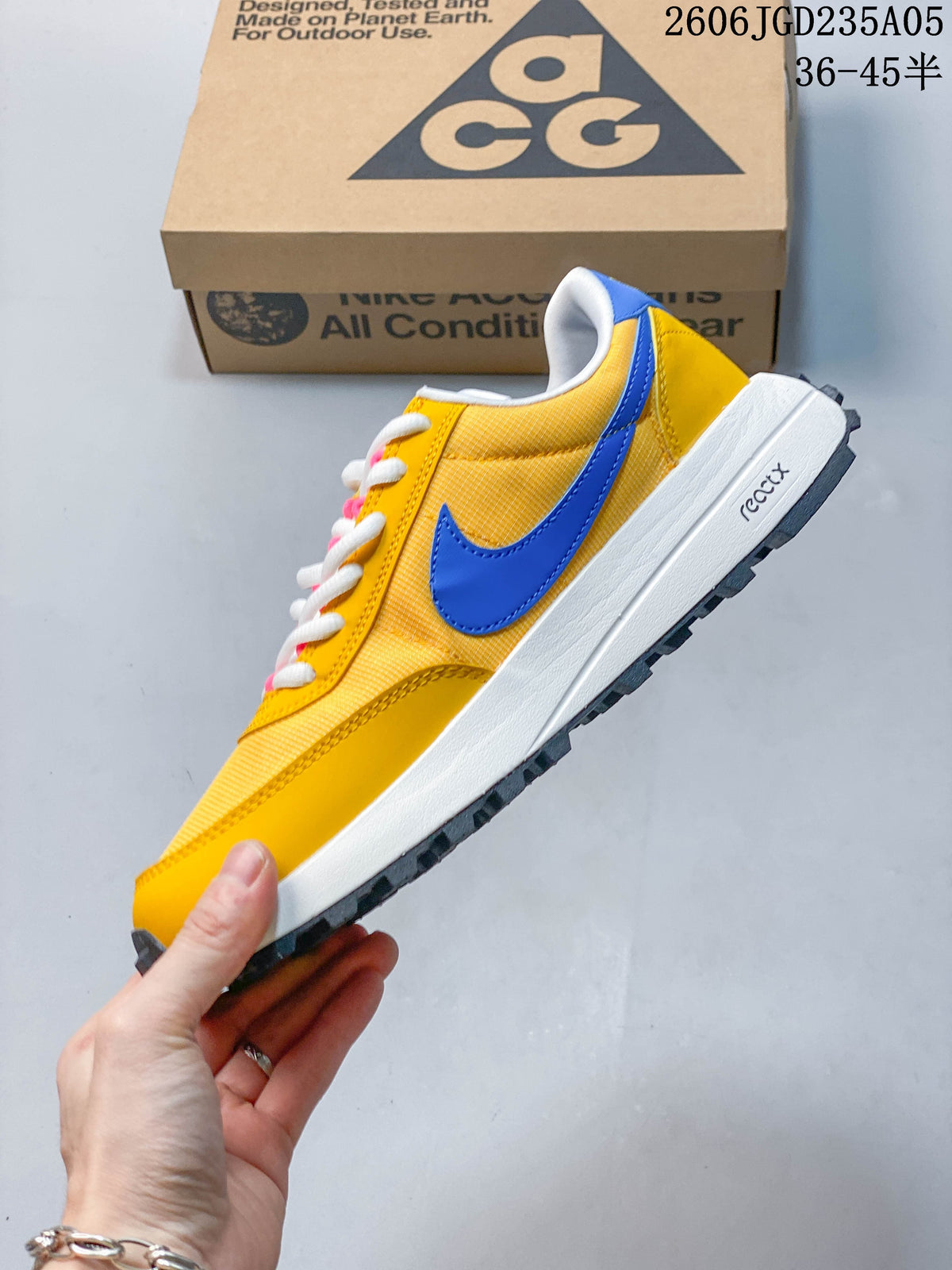 Side view showing the blue swoosh, yellow upper, white midsole, and dark outsole