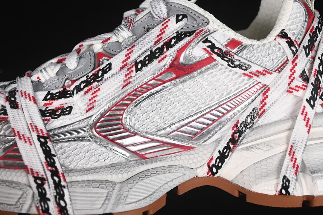 Close-up of the side panels, metallic-looking accents, and logo-patterned laces