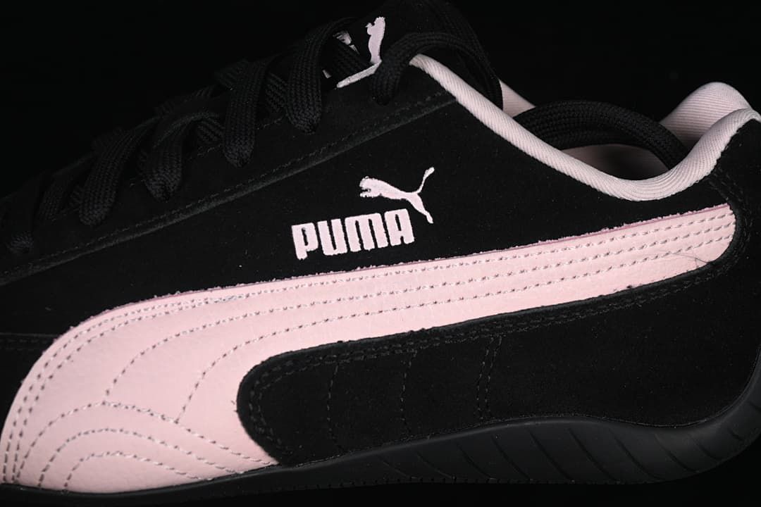 Close-up of the black upper, pale pink Formstrip, and Puma side branding.