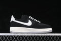 Side view of a black Nike Air Force 1 '07 Low with white Swoosh and gray outsole