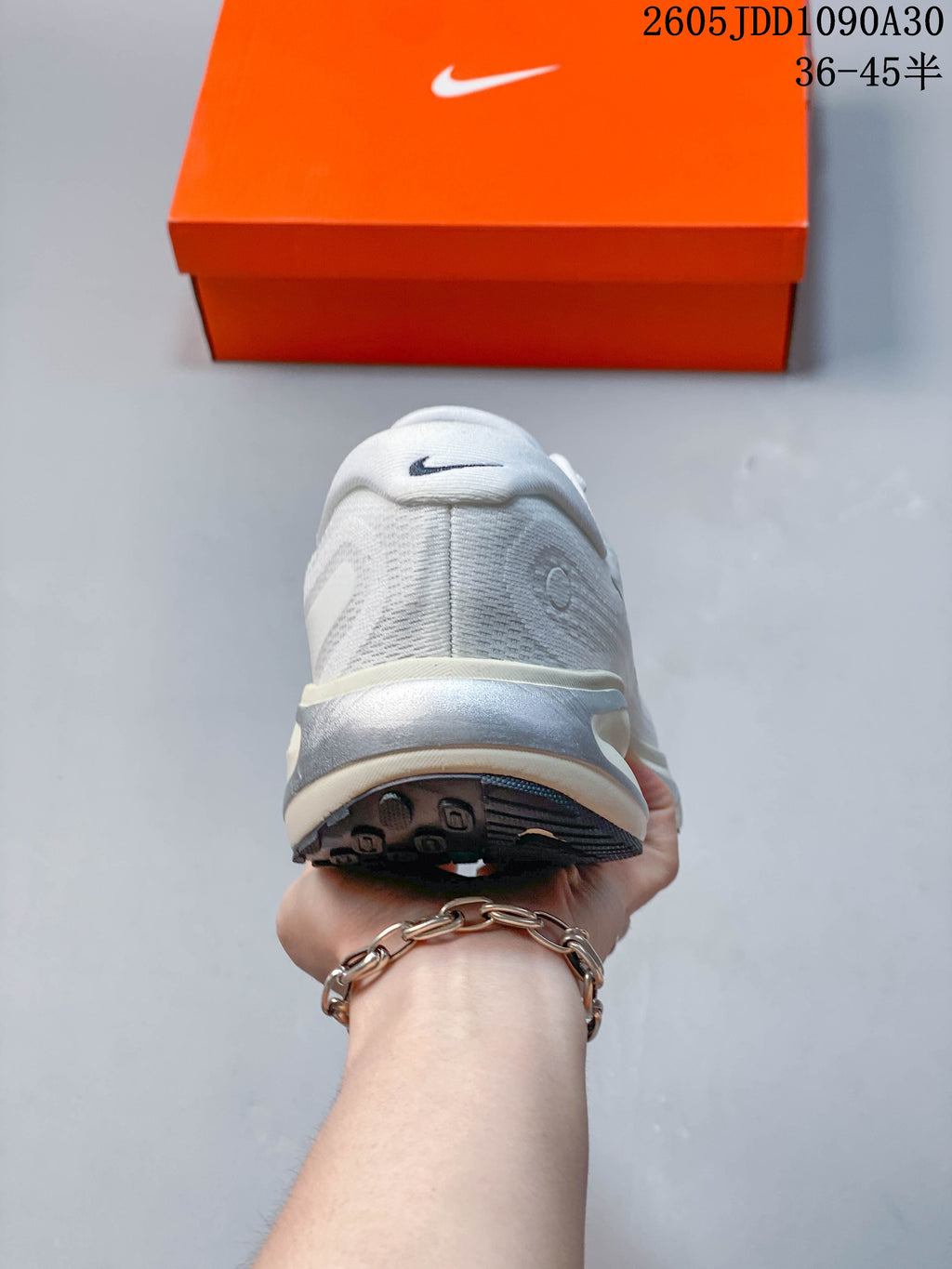Rear view of a Nike Journey Run shoe showing the heel and outsole.