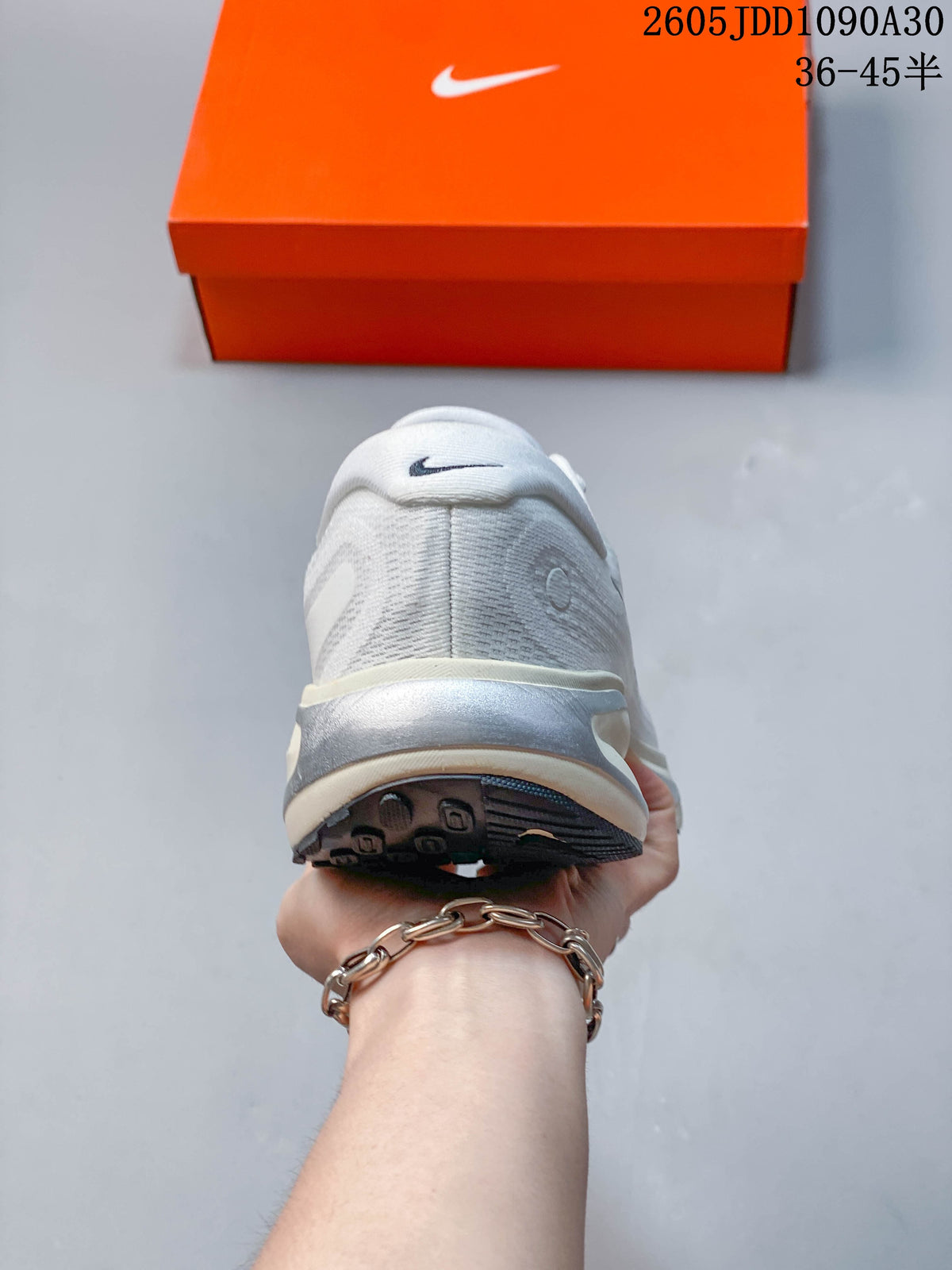 Rear view of a Nike Journey Run shoe showing the heel and outsole.