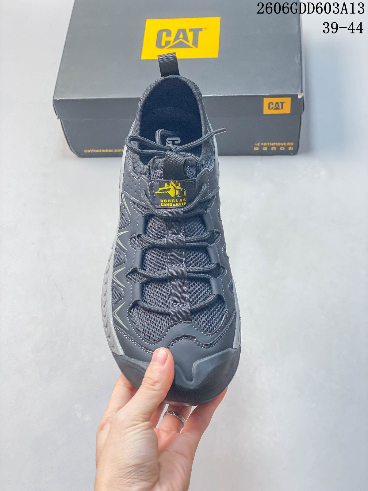Top view of the sneaker showing its laces, mesh tongue, and yellow tongue branding