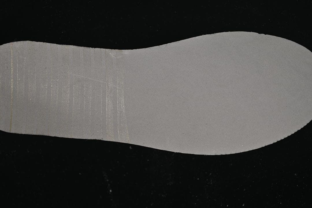 Grey removable insole shown from the underside