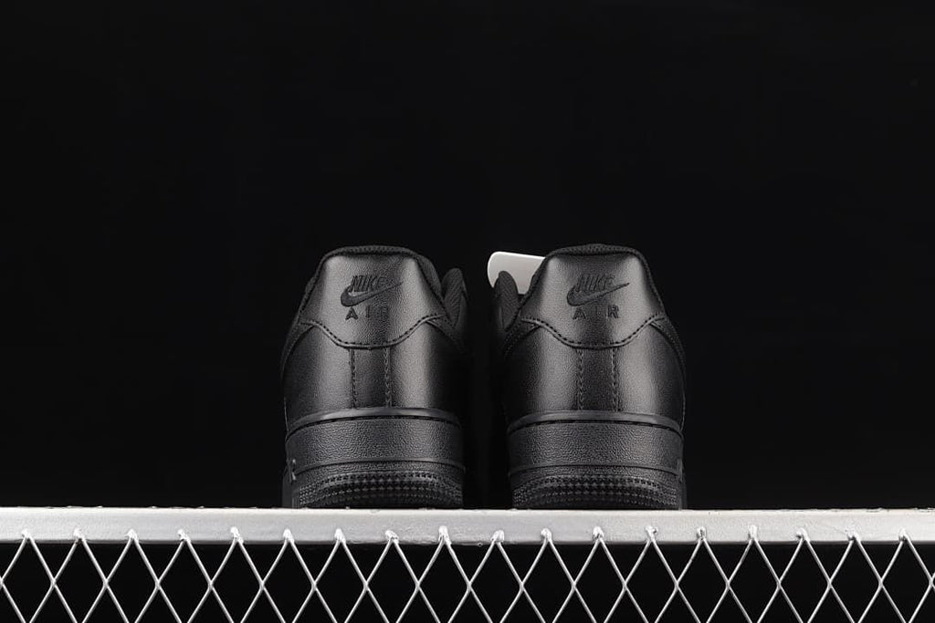 Rear view of the pair showing black heel panels and branding.