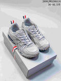 Pair of silver-toned ASICS GT-2160 sneakers shown from above at an angle.
