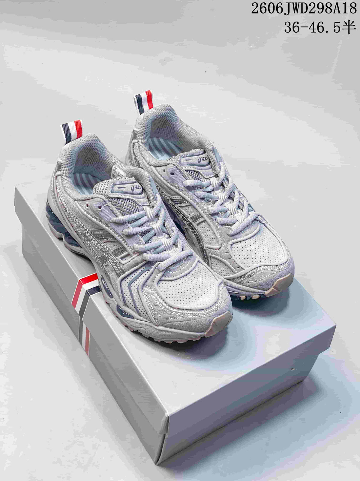 Pair of silver-toned ASICS GT-2160 sneakers shown from above at an angle.