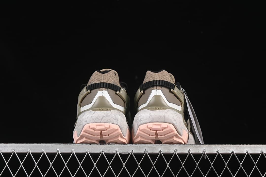 Rear view of both shoes showing heel details and pink outsole sections