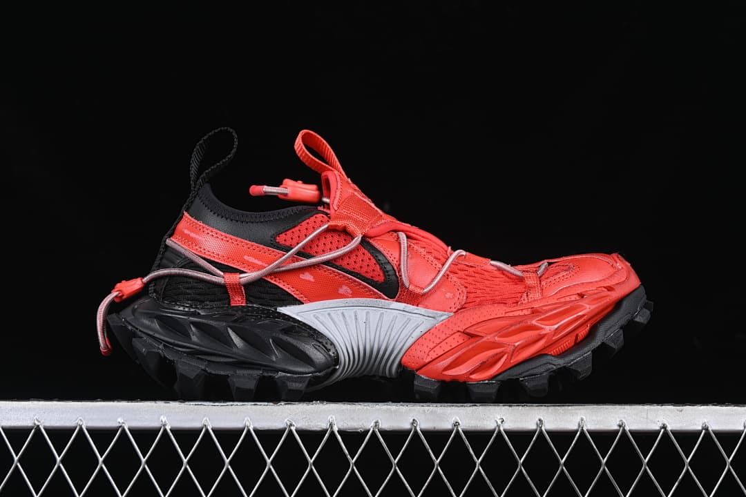 Side profile of the red and black low-top sneaker
