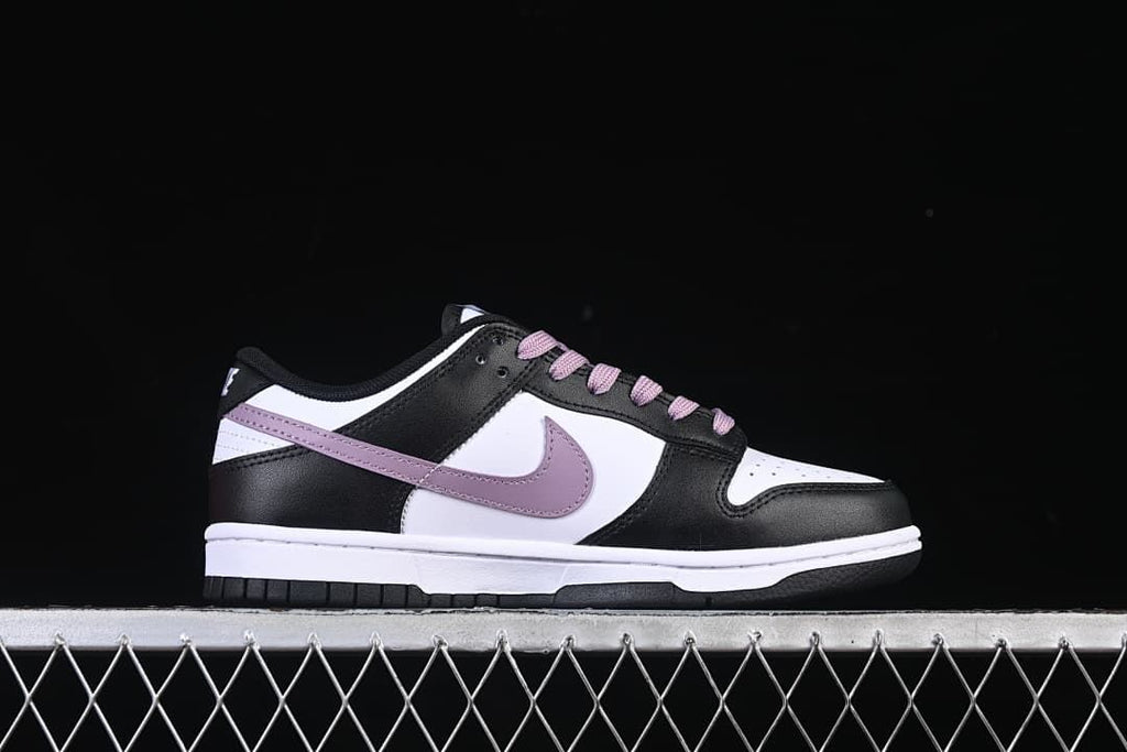 Side profile of the sneaker with purple Swoosh and white midsole