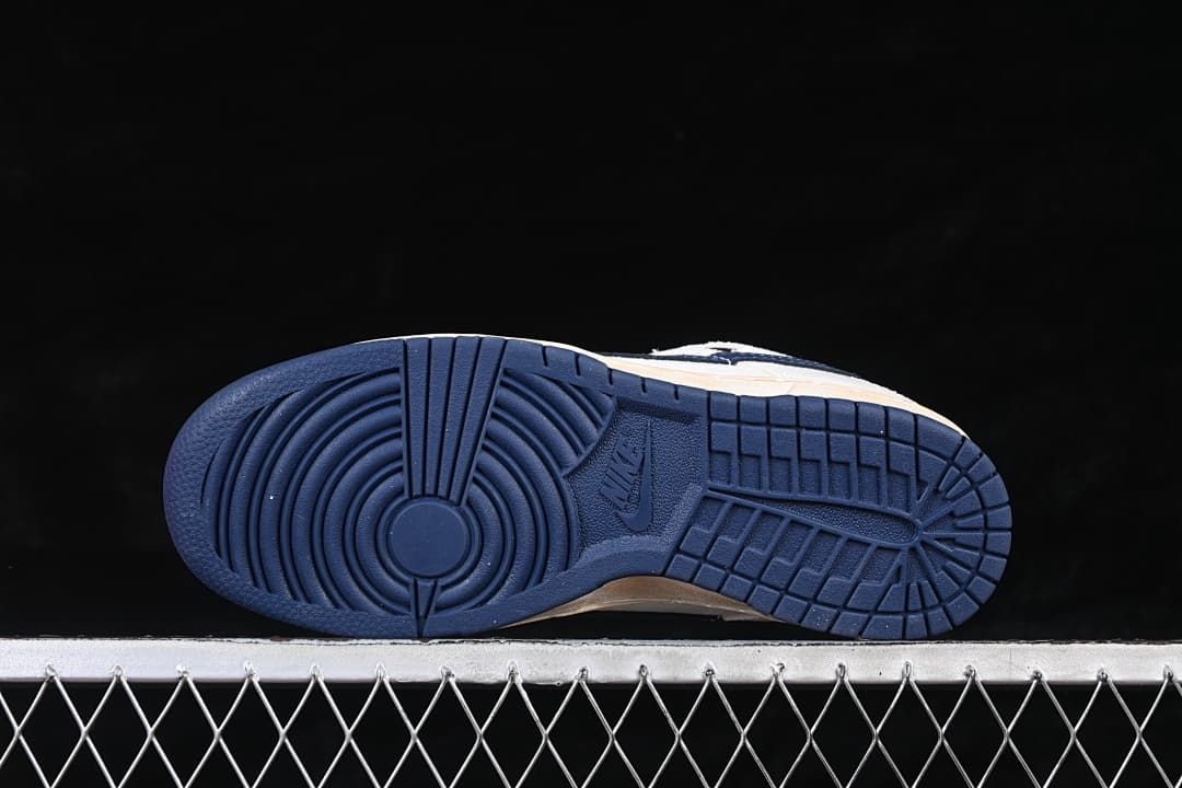 Underside view showing the navy outsole tread pattern