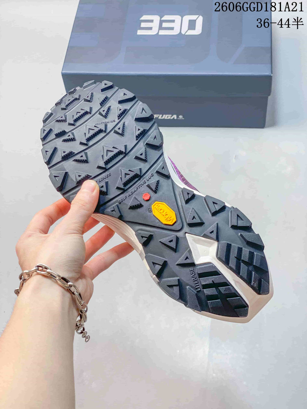 Close-up of the trail shoes' lugged outsole