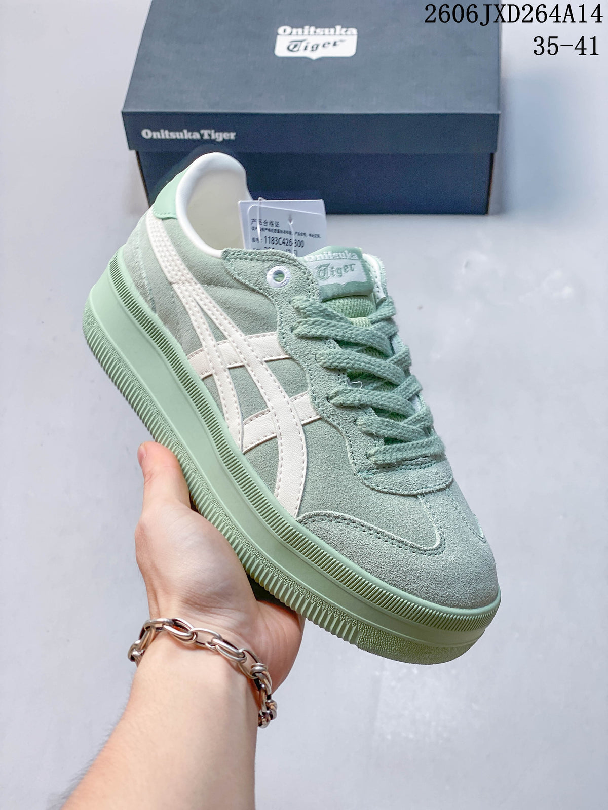 Close-up side view of pastel green Onitsuka Tiger Tokuten Chunk sneaker