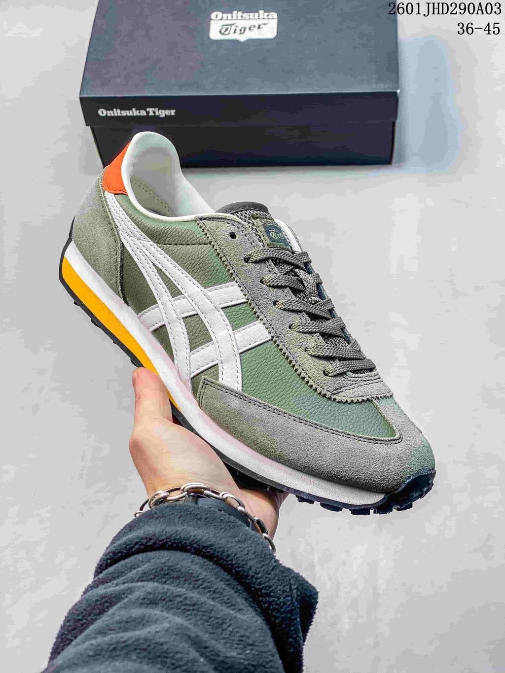Muted green Onitsuka Tiger EDR 78 sneaker with white side stripes and orange heel accent.