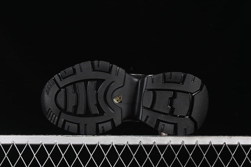 Underside view of the black treaded outsole